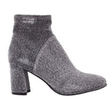 Metallic silver ankle bootie with textured sparkle and chunky block heel