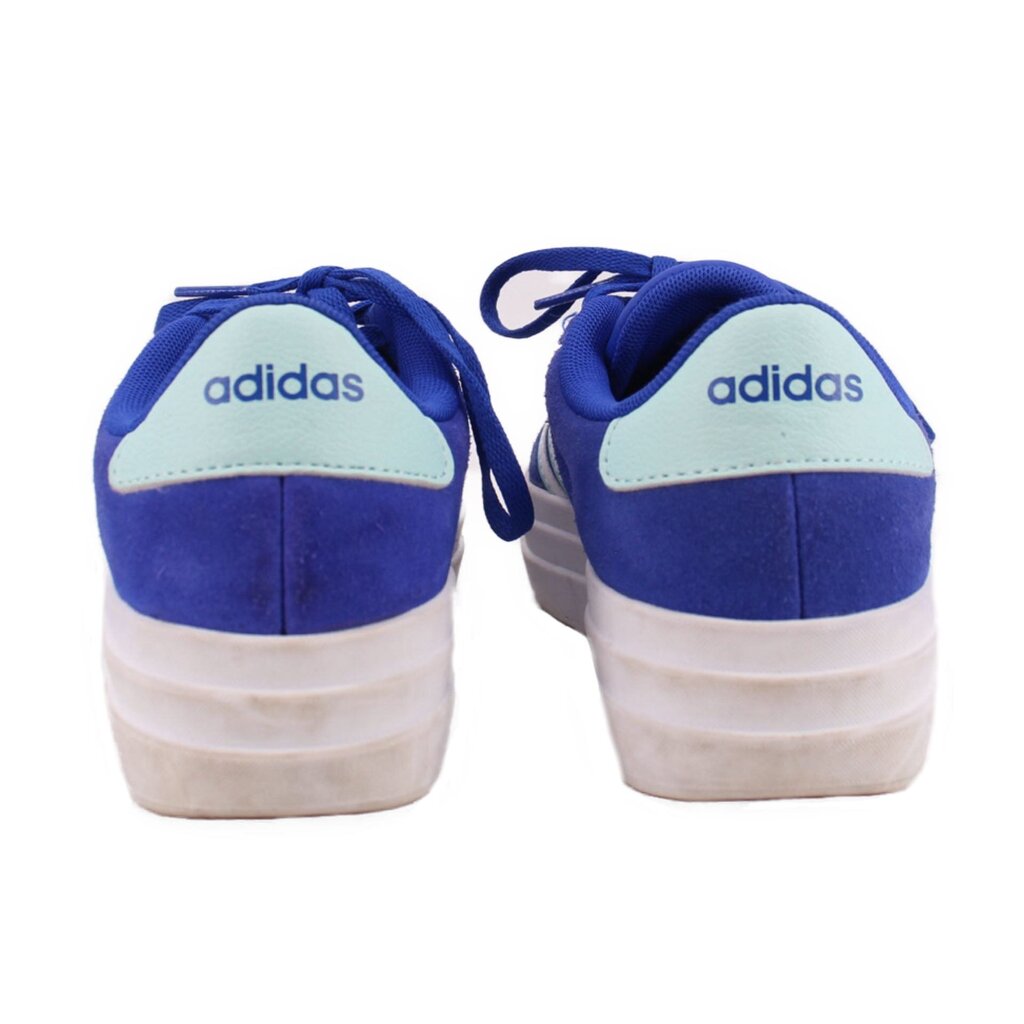 Blue sneakers with white heel tabs and Adidas text on the back