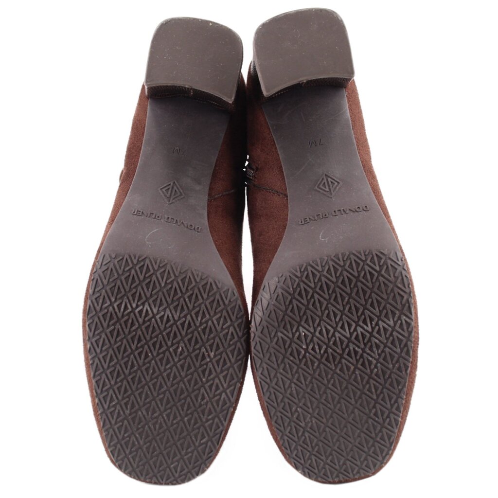 Brown boot outsoles with patterned tread and molded rubber heel
