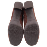 Brown boot outsoles with patterned tread and molded rubber heel