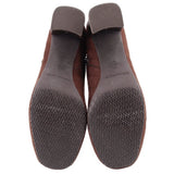 Brown boot outsoles with patterned tread and molded rubber heel