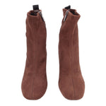 Pair of brown faux suede ankle boots with side zipper and elastic gore