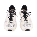 Pair of white ON Cloud mesh sneakers with black laces and perforated toe panels