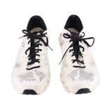Pair of white ON Cloud mesh sneakers with black laces and perforated toe panels