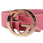 Pink leather belt with large Gucci GG interlocking buckle detail, gold-tone finish