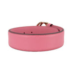 Pink leather belt with perforated adjustment holes and stitched edge
