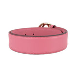 Pink leather belt with perforated adjustment holes and stitched edge