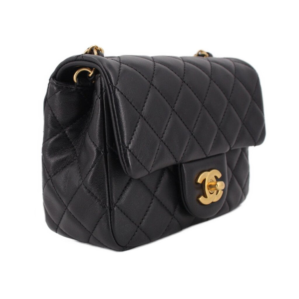 Black quilted mini crossbody bag with gold chain and front flap CC turn-lock