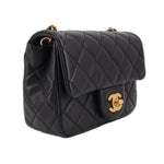 Black quilted mini crossbody bag with gold chain and front flap CC turn-lock