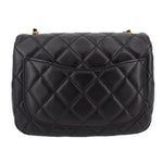 Black quilted mini crossbody bag back view with flap and stitched diamond pattern