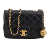 Black quilted mini CHANEL crossbody bag with gold chain and front CC logo