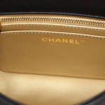 CHANEL logo on interior lining of black mini crossbody bag with zipper trim