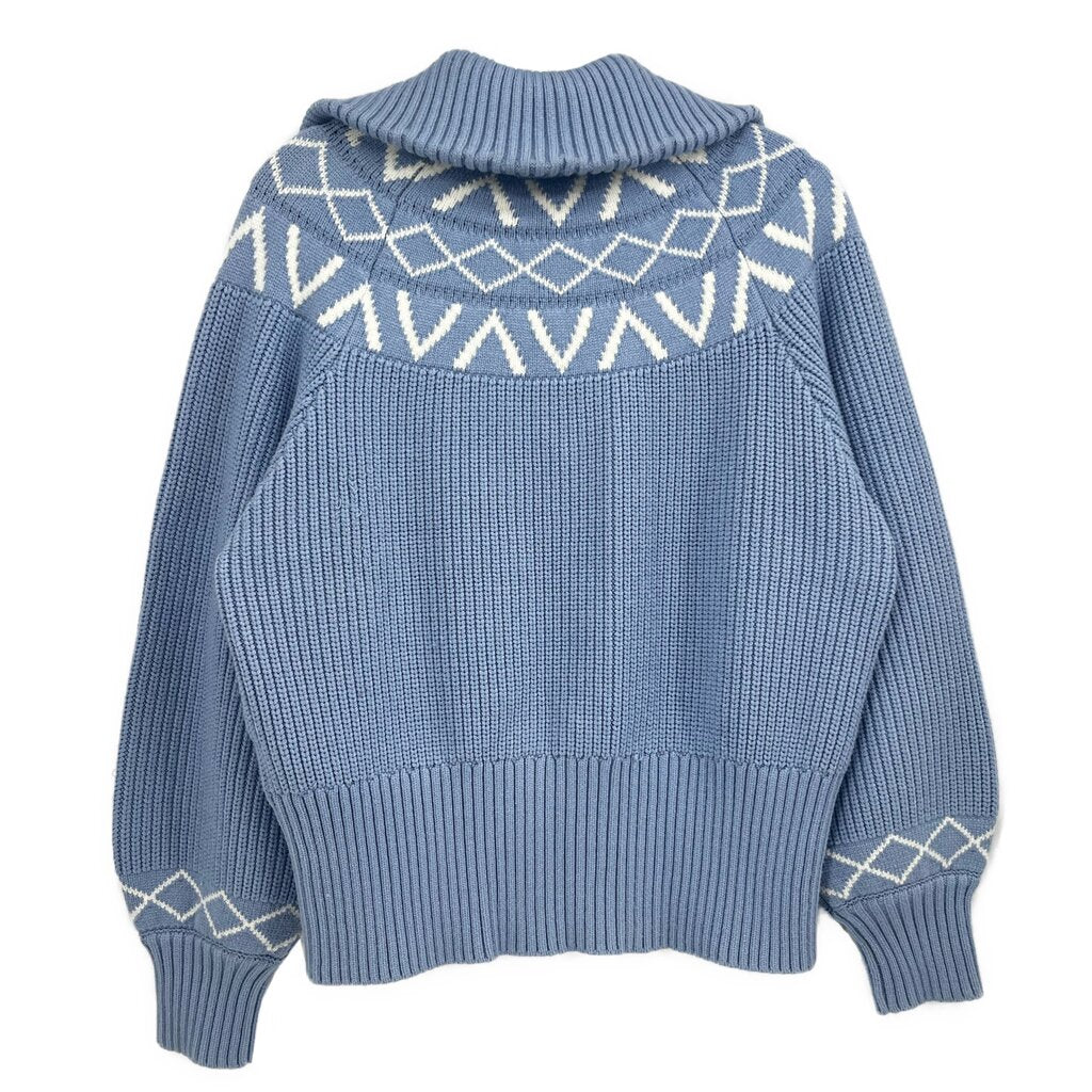 Blue knit pullover with ribbed turtleneck and geometric yoke pattern, back view