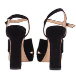 Black platform heeled sandal back view with ankle strap and chunky heel