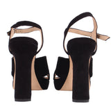 Black platform heeled sandal back view with ankle strap and chunky heel
