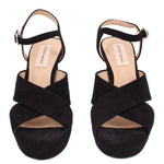 Pair of black platform heeled sandals with ankle straps and open toe