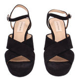 Pair of black platform heeled sandals with ankle straps and open toe