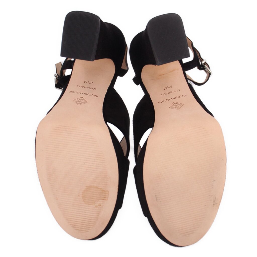 Black heeled sandal with open toe; view of footbeds and heel blocks