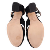 Black heeled sandal with open toe; view of footbeds and heel blocks