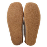 Brown suede boot outsoles with rounded toe tread