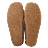 Brown suede boot outsoles with rounded toe tread