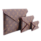 Monogram canvas pouch set with cross-over flap and gold-tone snap closures