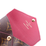 Pink leather inner label on pouch with Louis Vuitton branding and gold stud