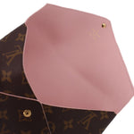 Light pink interior panel of monogram pouch with stitched seam detail