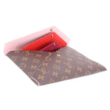 Monogram canvas pouch set with bright pink interior lining and snap hardware