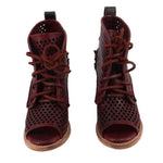 Pair of red perforated lace-up open-toe ankle boots with mid heels