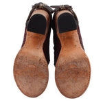 Perforated lace-up ankle boot soles with textured tread underside