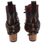 Dark lace-up ankle boots with perforated sides and buckle straps on heel