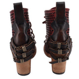 Dark lace-up ankle boots with perforated sides and buckle straps on heel