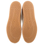 Mary Jane sneakers outsoles with hexagon traction pattern on tan rubber