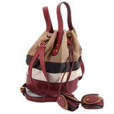 Bucket crossbody bag with double straps, burgundy base, and check canvas panels