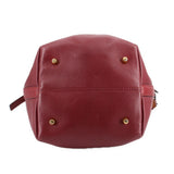Burgundy leather bucket bag back with gold-tone studs and small side tab
