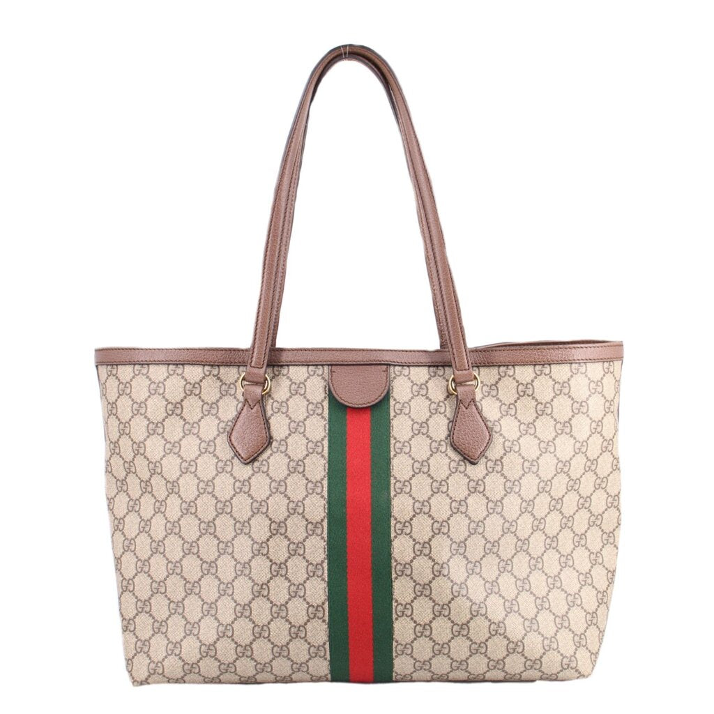 Large tote bag featuring GG monogram print, brown leather handles and center stripe.