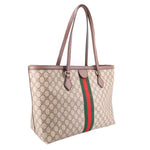 Large tote bag angled view with GG canvas, brown leather details and green-red stripe.