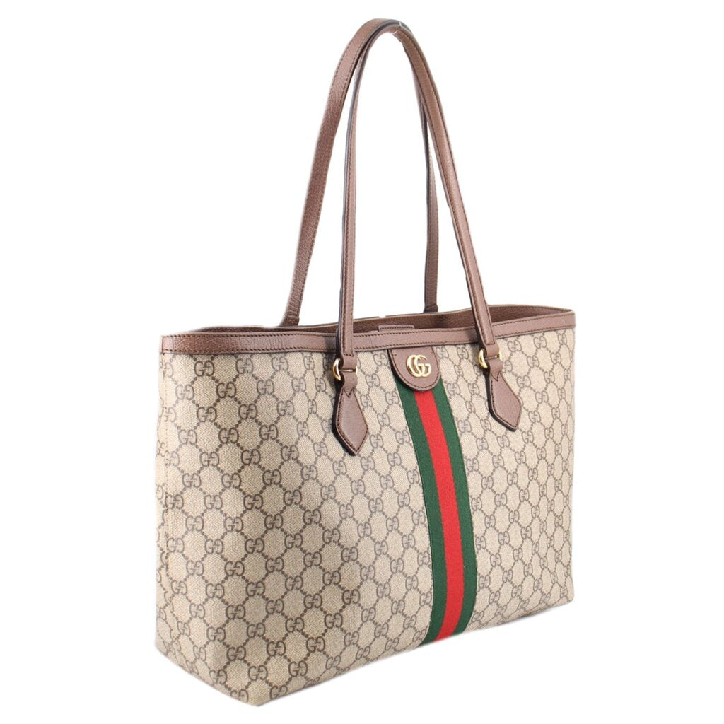 Large tote bag in GG canvas with brown handles, side profile and green-red stripe accent.