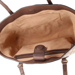 Open GUCCI tote interior with tan lining, leather strap tab, and top zipper pocket.