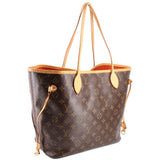Monogram tote bag with tan leather handles, side hardware, and striped interior lining