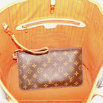 Tote bag interior with striped lining and monogram pocket featuring top zipper