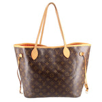 Monogram Neverfull MM tote bag with tan leather handles and gold-tone hardware