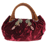 Maroon velvet mini spy bag with top handle and dotted fabric texture