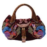 Maroon velvet mini bag with top handles, embroidered motifs, and front clasp detail