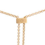 Gold-tone rectangular slider charm with etched symbol and two dangling chain lengths