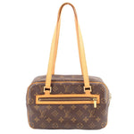 Louis Vuitton monogram shoulder bag with long tan straps and front zip pocket