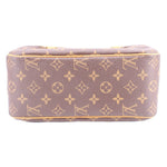 Monogram canvas shoulder bag bottom view with tan leather trim and zip edge