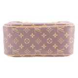 Monogram canvas shoulder bag bottom view with tan leather trim and zip edge