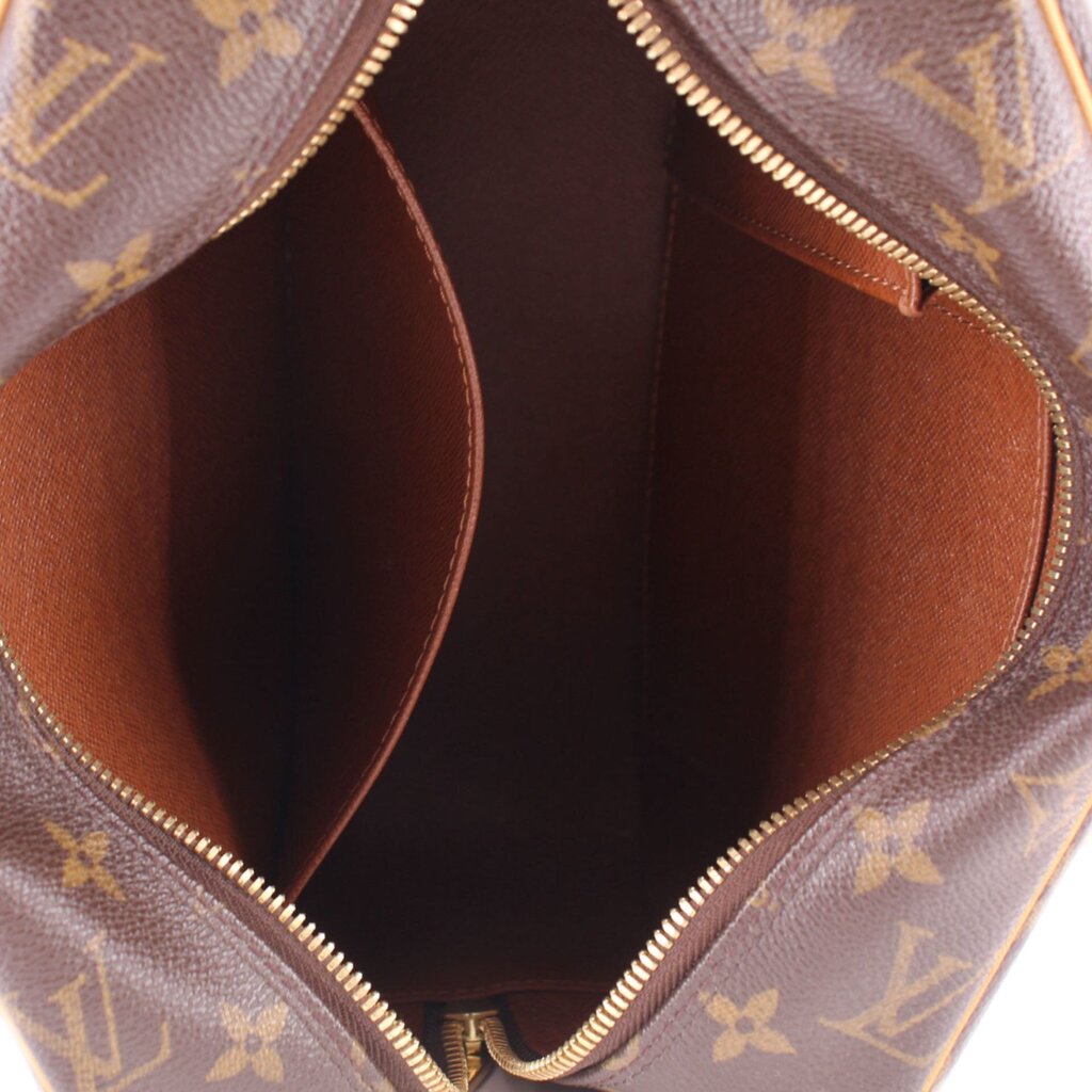 LOUIS VUITTON CITE MM interior view with brown lining and gold-tone zipper trim